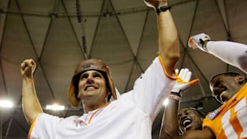 ATLANTA, GA - AUGUST 31: Head coach Derek Dooley of the Tennessee Volunteers celebrates with the leather helmet after their 35-21 over the North Carolina State Wolfpack at Georgia Dome on August 31, 2012 in Atlanta, Georgia. (Photo by Kevin C. Cox/Getty Images)