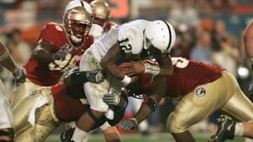 MIAMI GARDENS, FL - JANUARY 3: Quaterback Michael Robinson #12 of the Penn State Nittany Lions is sacked during the 72nd Fed Ex Orange Bowl against the Florida State Seminoles at Dolphins Stadium on January 3, 2005 in Miami Gardens, Florida. Penn State defeated Florida State 26-23 in triple overtime. (Photo by: Doug Benc/Getty Images)