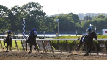 Jun 6, 2015; Elmont, NY, USA; Victor Espinoza aboard American Pharoah (5) comes down the stretch to win the 2015 Belmont Stakes at Belmont Park. Mandatory Credit: Winslow Townson-USA TODAY Sports