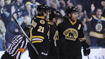 Dec 12, 2015; Boston, MA, USA; Boston Bruins center Ryan Spooner (middle) is congratulated by teammates left wing Loui Eriksson (21) and center Patrice Bergeron (37) after scoring his second goal of the game during the second period against the Florida Panthers at TD Garden. Mandatory Credit: Bob DeChiara-USA TODAY Sports