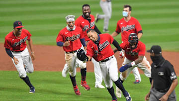 CLEVELAND, OHIO - SEPTEMBER 25: Cesar Hernandez #7 of the Cleveland Indians celebrates with his teammates after hitting a walk-off RBI single during the ninth inning against the Pittsburgh Pirates at Progressive Field on September 25, 2020 in Cleveland, Ohio. The Indians defeated the Pirates 4-3. (Photo by Jason Miller/Getty Images)