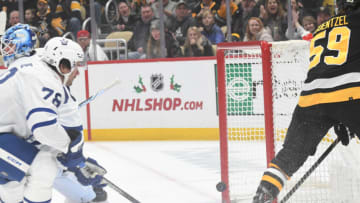 Nov 25, 2023; Pittsburgh, Pennsylvania, USA; Pittsburgh Penguins left wing Jake Guentzel (59) scores against the Toronto Maple Leafs during the first period at PPG Paints Arena. Mandatory Credit: Philip G. Pavely-USA TODAY Sports