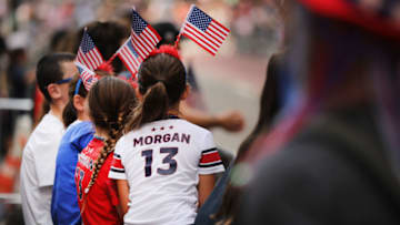 NEW YORK, NEW YORK - JULY 10: People cheer as members of the US Women's National Soccer Team travel down the "Canyon of Heroes" in a ticker tape parade on July 10, 2019 in New York City. The team defeated the Netherlands 2-0 Sunday in France to take the 2019 Women’s World Cup. (Photo by Spencer Platt/Getty Images)