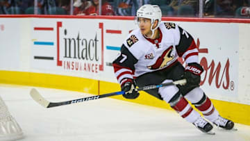 Oct 5, 2016; Calgary, Alberta, CAN; Arizona Coyotes defenseman Anthony DeAngelo (77) skates with the puck against Calgary Flames during a preseason hockey game at Scotiabank Saddledome. Mandatory Credit: Sergei Belski-USA TODAY Sports
