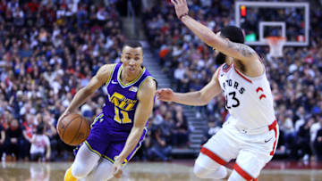 TORONTO, ON - JANUARY 1: Dante Exum #11 of the Utah Jazz dribbles the ball as Fred VanVleet #23 of the Toronto Raptors defends during the second half of an NBA game at Scotiabank Arena on January 1, 2019 in Toronto, Canada. NOTE TO USER: User expressly acknowledges and agrees that, by downloading and or using this photograph, User is consenting to the terms and conditions of the Getty Images License Agreement. (Photo by Vaughn Ridley/Getty Images)