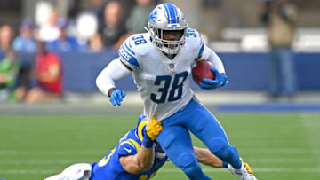 Oct 24, 2021; Inglewood, California, USA; Detroit Lions defensive back C.J. Moore (38) escapes the tackle by Los Angeles Rams wide receiver Ben Skowronek (18) and runs for a first down in the second half of the game at SoFi Stadium. Mandatory Credit: Jayne Kamin-Oncea-USA TODAY Sports