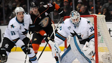 February 2, 2016; Anaheim, CA, USA; San Jose Sharks defenseman Justin Braun (61) helps goalie Martin Jones (31) defend the goal against Anaheim Ducks right wing Corey Perry (10) during the second period at Honda Center. Mandatory Credit: Gary A. Vasquez-USA TODAY Sports