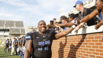 Oct 11, 2014; Atlanta, GA, USA; Duke Blue Devils guard Laken Tomlinson (77) celebrates a victory against the Georgia Tech Yellow Jackets at Bobby Dodd Stadium. Duke defeated Georgia Tech 31-25. Mandatory Credit: Brett Davis-USA TODAY Sports