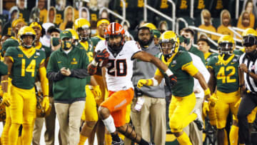 Dec 12, 2020; Waco, Texas, USA; Oklahoma State Cowboys running back Dominic Richardson (20) breaks free on a 43-yard run against the Baylor Bears during the second half at McLane Stadium. Mandatory Credit: Raymond Carlin III-USA TODAY Sports