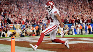 MIAMI, FL - DECEMBER 29: Charleston Rambo #14 of the Oklahoma Sooners completes the catch for a touchdown in the third quarter during the College Football Playoff Semifinal against the Alabama Crimson Tide at the Capital One Orange Bowl at Hard Rock Stadium on December 29, 2018 in Miami, Florida. (Photo by Mike Ehrmann/Getty Images)