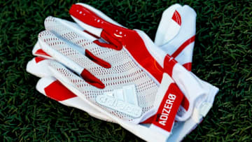 CHAMPAIGN, IL - SEPTEMBER 29: A pair of Nebraska Cornhuskers Adidas gloves is seen on the field before the game at Memorial Stadium on September 29, 2017 in Champaign, Illinois. (Photo by Michael Hickey/Getty Images)