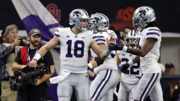 ARLINGTON, TX - DECEMBER 3: Will Howard #18 of the Kansas State Wildcats celebrates with teammates after throwing a touchdown pass against the TCU Horned Frogs in the first half of the Big 12 Football Championship at AT&T Stadium on December 3, 2022 in Arlington, Texas. (Photo by Ron Jenkins/Getty Images)
