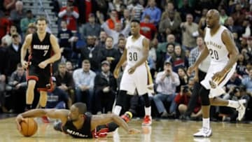 Feb 27, 2015; New Orleans, LA, USA; Miami Heat guard Dwyane Wade (3) dives for a loose ball at Smoothie King Center. The Pelicans won 104-102. Mandatory Credit: Rusty Costanza-USA TODAY Sports