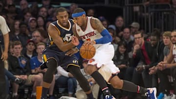 Nov 6, 2016; New York, NY, USA; New York Knicks small forward Carmelo Anthony (7) dribbles the ball against Utah Jazz power forward Derrick Favors (15) during the third quarter at Madison Square Garden. Utah won 114-109. Mandatory Credit: Gregory J. Fisher-USA TODAY Sports