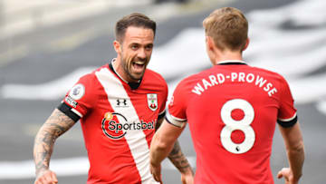 LONDON, ENGLAND - APRIL 21: Danny Ings celebrates with his team-mate James Ward-Prowse after opening the scoring for Southampton during the Premier League match between Tottenham Hotspur and Southampton at Tottenham Hotspur Stadium on April 21, 2021 in London, United Kingdom. Sporting stadiums around the UK remain under strict restrictions due to the Coronavirus Pandemic as Government social distancing laws prohibit fans inside venues resulting in games being played behind closed doors. (Photo by Sebastian Frej/MB Media/Getty Images)