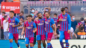 BARCELONA, SPAIN - SEPTEMBER 26: Memphis Depay of FC Barcelona celebrates with team mates after scoring his team's first goal during the LaLiga Santander match between FC Barcelona and Levante UD at Camp Nou on September 26, 2021 in Barcelona, Spain. (Photo by Pedro Salado/Quality Sport Images/Getty Images)