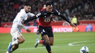 Lille's Brazilian defender Gabriel dos Santos Magalhaes (R) fights for the ball with Montpellier's French forward Gaetan Laborde during the French L1 football match between Lille OSC (LOSC) and Montpellier Herault Sport Club (MHSC) at the Pierre Mauroy Stadium in Villeneuve-d'Ascq, on December 13, 2019. (Photo by FRANCOIS LO PRESTI / AFP) (Photo by FRANCOIS LO PRESTI/AFP via Getty Images)