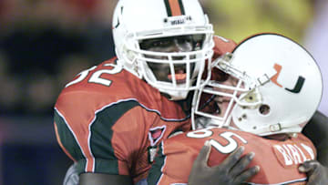 25 Oct 2001: Frank Gore #32 and Martin Bibla #65 of Miami celebrate during the game against West Virginia at the Orange Bowl in Miami, Florida. The University Of Miami won 45-3. DIGITAL IMAGE. Mandatory Credit: Eliot Schechter/Allsport