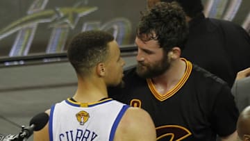 June 19, 2016; Oakland, CA, USA; Cleveland Cavaliers forward Kevin Love (0) speaks with Golden State Warriors guard Stephen Curry (30) following the 93-89 victory in game seven of the NBA Finals at Oracle Arena. Mandatory Credit: Cary Edmondson-USA TODAY Sports