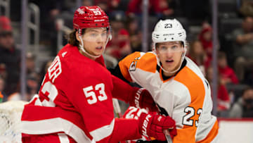 Feb 12, 2022; Detroit, Michigan, USA; Detroit Red Wings defenseman Moritz Seider (53) defends the front of the net against Philadelphia Flyers left wing Oskar Lindblom (23) during the third period at Little Caesars Arena. Mandatory Credit: Raj Mehta-USA TODAY Sports