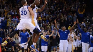 December 3, 2013; Oakland, CA, USA; Golden State Warriors point guard Stephen Curry (30) and small forward Harrison Barnes (40) celebrate after a three-point basket by Barnes during the fourth quarter against the Toronto Raptors at Oracle Arena. The Warriors defeated the Raptors 112-103. Mandatory Credit: Kyle Terada-USA TODAY Sports
