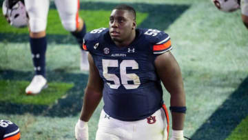 Auburn football offensive lineman Tashawn Manning (56) walks off the field after the game at Jordan-Hare Stadium in Auburn, Ala., on Saturday, Nov. 21, 2020. Auburn defeated Tennessee 30-17.