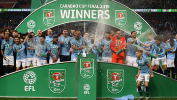 LONDON, ENGLAND - FEBRUARY 24: Manchester City players celebrate with the trophy after winning the Carabao Cup Final between Chelsea and Manchester City at Wembley Stadium on February 24, 2019 in London, England. (Photo by Clive Rose/Getty Images)