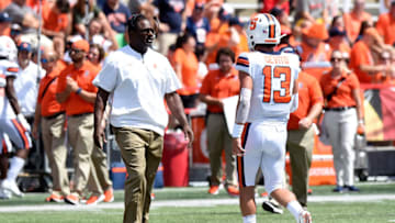 COLLEGE PARK, MD - SEPTEMBER 07: Head Coach Dino Babers of the Syracuse Orange talks with Tommy DeVito #13 during a timeout in the game against the Maryland Terrapins at Maryland Stadium on September 7, 2019 in College Park, Maryland. (Photo by G Fiume/Maryland Terrapins/Getty Images)