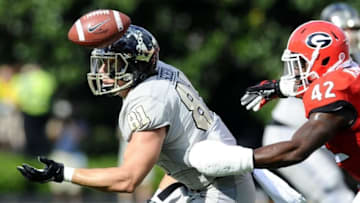 Sep 12, 2015; Nashville, TN, USA; Vanderbilt Commodores tight end Steven Scheu (81) is unable to catch a pass while defended by Georgia Bulldogs linebacker Tim Kimbrough (42) during the first half at Vanderbilt Stadium. Mandatory Credit: Christopher Hanewinckel-USA TODAY Sports