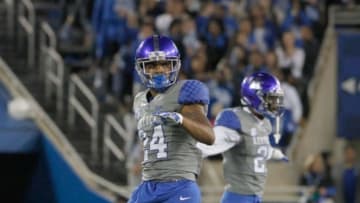 Sep 26, 2015; Lexington, KY, USA; Kentucky Wildcats cornerback Blake McClain (24) and defensive back Chris Westry (21) celebrate during the game against the Missouri Tigers at Commonwealth Stadium. Kentucky defeated Missouri Tigers 21-13. Mandatory Credit: Mark Zerof-USA TODAY Sports