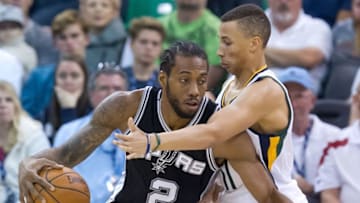 Nov 4, 2016; Salt Lake City, UT, USA; Utah Jazz guard Dante Exum (11) defends against San Antonio Spurs forward Kawhi Leonard (2) during the first half at Vivint Smart Home Arena. Mandatory Credit: Russ Isabella-USA TODAY Sports