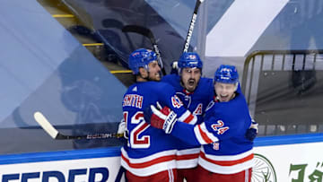 Chris Kreider #20 of the New York Rangers celebrates with his teammates after scoring a goal on James Reimer #47 of the Carolina Hurricanes during the second period in Game Three of the Eastern Conference Qualification Round. (Photo by Andre Ringuette/Freestyle Photo/Getty Images)