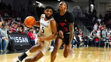 Cincinnati Bearcats guard David DeJulius drives to the basket against the SMU Mustangs at Fifth Third Arena. The Enquirer.