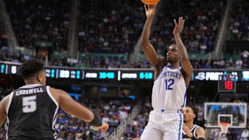 Mar 17, 2023; Greensboro, NC, USA; Kentucky Wildcats guard Antonio Reeves (12) shoots against Providence Friars forward Ed Croswell (5) in the second half at Greensboro Coliseum. Mandatory Credit: Bob Donnan-USA TODAY Sports