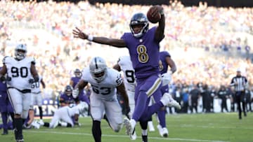 BALTIMORE, MARYLAND - NOVEMBER 25: Quarterback Lamar Jackson #8 of the Baltimore Ravens rushes for a touchdown in the third quarter against the Oakland Raiders at M&T Bank Stadium on November 25, 2018 in Baltimore, Maryland. (Photo by Patrick Smith/Getty Images)