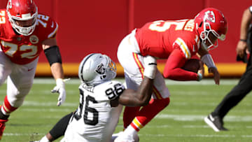 KANSAS CITY, MISSOURI - OCTOBER 11: Clelin Ferrell #96 of the Las Vegas Raiders wraps up Patrick Mahomes #15 of the Kansas City Chiefs during the fourth quarter at Arrowhead Stadium on October 11, 2020 in Kansas City, Missouri. (Photo by Jamie Squire/Getty Images)