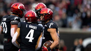 Cincinnati Bearcats running back Ethan Wright celebrates against SMU. The Enquirer.