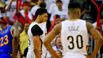 Apr 25, 2015; New Orleans, LA, USA; New Orleans Pelicans forward Anthony Davis (23) bits his jersey in the final seconds of the fourth quarter as the Golden State Warriors eliminated the Pelicans in game four of the first round of the NBA Playoffs at the Smoothie King Center. The Warriors defeated the Pelicans 109-98. Mandatory Credit: Derick E. Hingle-USA TODAY Sports