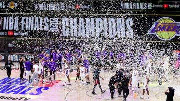 LAKE BUENA VISTA, FLORIDA - OCTOBER 11: The Los Angeles Lakers celebrate with the trophy after winning the 2020 NBA Championship Final over the Miami Heat in Game Six of the 2020 NBA Finals at AdventHealth Arena at the ESPN Wide World Of Sports Complex on October 11, 2020 in Lake Buena Vista, Florida. NOTE TO USER: User expressly acknowledges and agrees that, by downloading and or using this photograph, User is consenting to the terms and conditions of the Getty Images License Agreement. (Photo by Douglas P. DeFelice/Getty Images)