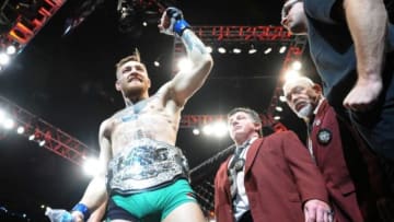 December 12, 2015; Las Vegas, NV, USA; Conor McGregor exits the octagon following his championship victory against Jose Aldo during UFC 194 at MGM Grand Garden Arena. Mandatory Credit: Gary A. Vasquez-USA TODAY Sports