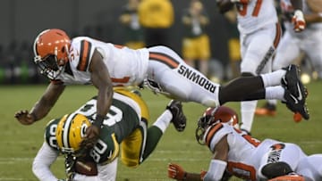 Aug 12, 2016; Green Bay, WI, USA; Green Bay Packers tight end Justin Perillo (80) is tackled by Cleveland Browns linebacker Barkevious Mingo (51) after catching a pass in the first quarter at Lambeau Field. Mandatory Credit: Benny Sieu-USA TODAY Sports