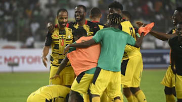 Ghana players celebrate their victory during the World Cup 2022 qualifying football match between Nigeria and Ghana (Photo by PIUS UTOMI EKPEI/AFP via Getty Images)