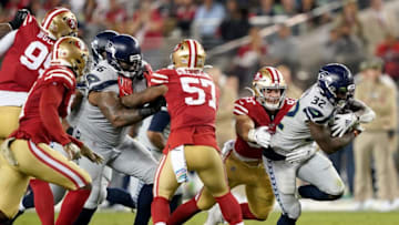 SANTA CLARA, CALIFORNIA - NOVEMBER 11: Running back Chris Carson #32 of the Seattle Seahawks runs against the defesne of defensive end Nick Bosa #97 of the San Francisco 49ers in the game at Levi's Stadium on November 11, 2019 in Santa Clara, California. (Photo by Thearon W. Henderson/Getty Images)