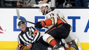 Sep 25, 2014; Los Angeles, CA, USA; Anaheim Ducks left wing Patrick Maroon (19) lands on referee Brad Watson after an attempted score during the shootout against the Los Angeles Kings at Staples Center. Kings won 4-3. Mandatory Credit: Jayne Kamin-Oncea-USA TODAY Sports