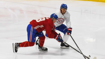 BROSSARD, QC - JUNE 28: Montreal Canadiens prospect Jesse Ylonen (56) and Montreal Canadiens center Alexandre Alain (68) battle for the puck during the Montreal Canadiens Development Camp on June 28, 2019, at Bell Sports Complex in Brossard, QC (Photo by David Kirouac/Icon Sportswire via Getty Images)