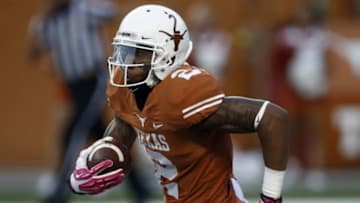 Sep 21, 2013; Austin, TX, USA; Texas Longhorns wide receiver Kendall Sanders (2) runs for yardage on the opening kickoff against the Kansas State Wildcats during a football game at Darrell K Royal-Texas Memorial Stadium. Mandatory Credit: Jim Cowsert-USA TODAY Sports