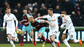 SWANSEA, WALES - MARCH 03: Marko Arnautovic of West Ham United is challenged by Andy King of Swansea City during the Premier League match between Swansea City and West Ham United at Liberty Stadium on March 3, 2018 in Swansea, Wales. (Photo by Jan Kruger/Getty Images)