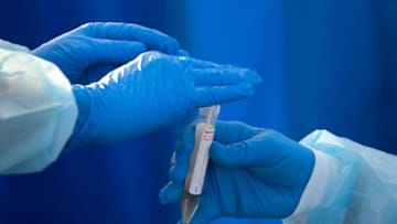 Florida Department of Health in Collier Count, DOH-Collier, health professionals secure a test sample, Tuesday, Dec. 29, 2020, at a COVID-19 testing site at Farm Workers Village in Immokalee.Ndn 0105 Ja Immokalee Covid Testing 02