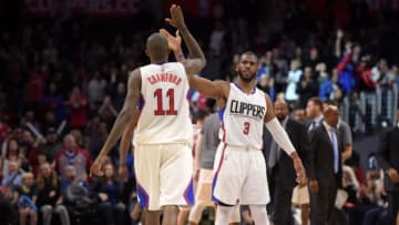 Jan 18, 2016; Los Angeles, CA, USA; Los Angeles Clippers guard Chris Paul (3) and guard Jamal Crawford (11) celebrate during an NBA basketball game against the Houston Rockets at Staples Center. The Clippers defeated the Rockers 140-132 in overtime. Mandatory Credit: Kirby Lee-USA TODAY Sports