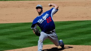 Mar 20, 2015; Mesa, AZ, USA; Los Angeles Dodgers starting pitcher Clayton Kershaw (22) throws the ball during the fourth inning against the Oakland Athletics at HoHoKam Stadium. Mandatory Credit: Matt Kartozian-USA TODAY Sports